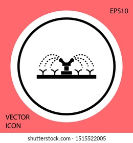 Black Automatic irrigation sprinklers icon isolated on red background. Watering equipment. Garden element. Spray gun icon. White circle button. Vector Illustration