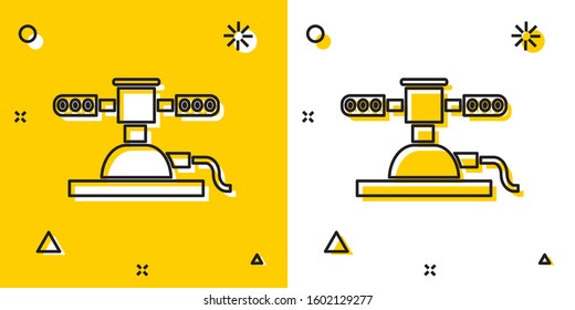 Black Automatic irrigation sprinklers icon isolated on yellow and white background. Watering equipment. Garden element. Spray gun icon. Random dynamic shapes. Vector Illustration