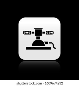 Black Automatic irrigation sprinklers icon isolated on black background. Watering equipment. Garden element. Spray gun icon. Silver square button. Vector Illustration