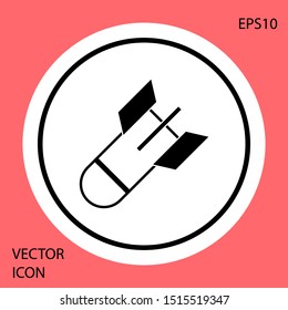 Black Aviation bomb icon isolated on red background. Rocket bomb flies down. White circle button. Vector Illustration