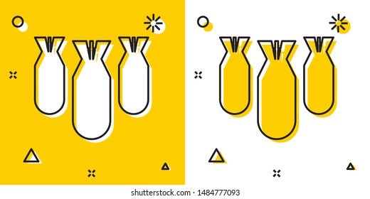 Black Aviation bombs icon isolated on yellow and white background. Rocket bomb flies down. Random dynamic shapes. Vector Illustration