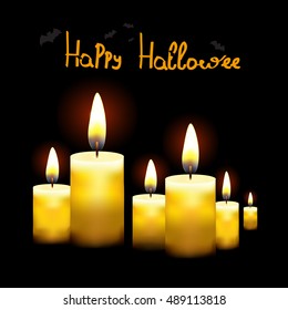 Black background with burning candles.Suitable for Halloween
