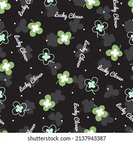 Color de fondo negro con patrón de percha verde primavera sin soldadura se puede utilizar para el diseño de fondo y de ropa