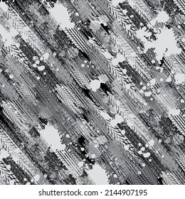 Black background with different tire tracks and ink blots design elements. Grunge dirty ink blots and splashes wallpaper