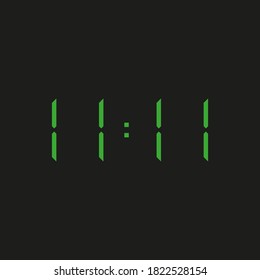 black background of electronic clock with four green numbers and datum 11:11 – repeating eleven - one 