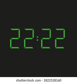 black background of electronic clock with four green numbers and datum 22:22 – repeating twenty two