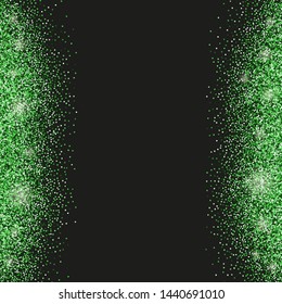 Black background with emerald green glitter sparkles or confetti and space for text.