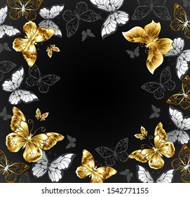 Black background with gold jewelry and white butterflies. Golden butterfly.