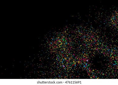 Black background with many falling tiny round random confetti, glitter and serpentine pieces blow and sprayed on distressed background. Isolated.