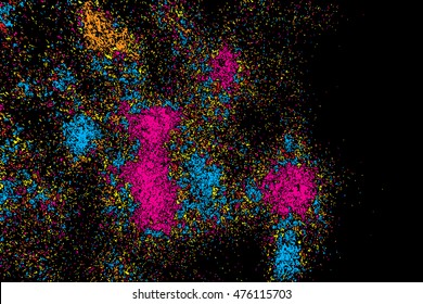 Black background with many falling tiny round random confetti, glitter and serpentine pieces blow and sprayed on distressed background. Isolated.