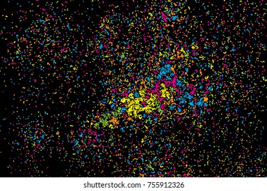 Black background with many falling tiny round random confetti, glitter and serpentine pieces blow and sprayed on black background. Isolated.
