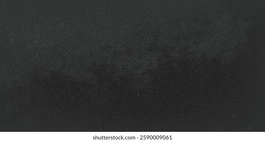 A black background with no visible objects. The background is a solid black color and has a rough texture