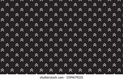Black background with white arrows and dots pattern