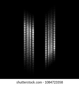 Black background with white dotted tire track silhouettes