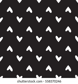 Black background with white hearts polka dots. Seamless vector pattern eps 10. Simple repeating texture. For Valentine's Day and Wedding. Gift wrap, print, fabric, textile retro fond for a card.