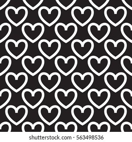 Black background with white hearts polka dots. Seamless vector pattern eps 10. Simple repeating texture. For Valentine's Day and Wedding. Gift wrap, print, fabric, textile retro fond.