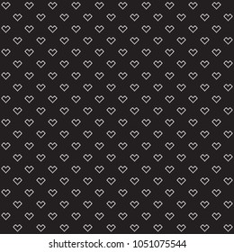 Black background, white hearts, seamless pattern.