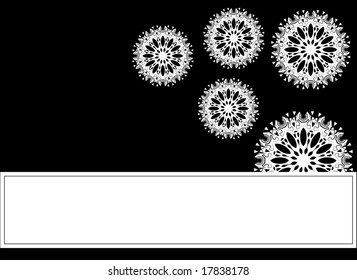 Black background with white snowflakes. Copy space included.