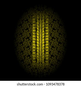 Black background with yellow floral pattern and tire track silhouette