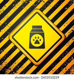 Black Bag of food for dog icon isolated on yellow background. Dog or cat paw print. Food for animals. Pet food package. Warning sign. Vector