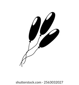 Black balloons floating against a white background during a festive celebration