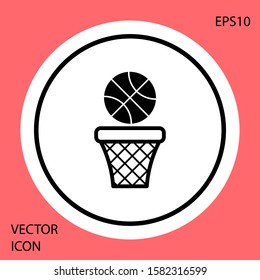 Black Basketball ball and basket icon isolated on red background. Ball in basketball hoop. White circle button. Vector Illustration