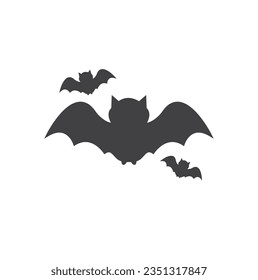 Black bat isolated on white vector background, Halloween icon. Illustration of nocturnal creatures. Flying bat silhouette traditional Halloween symbol.