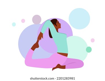 A black beautiful girl is doing yoga in the pose of a dove, a half-swan (Ardha Hamsasana). The girl is doing yoga, stretching her body. Rest from everyday life, sports, fitness and healthy lifestyle