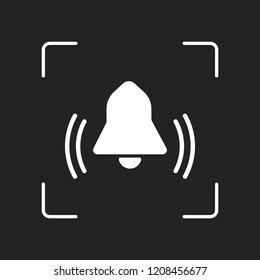 black bell icon. White object in camera autofocus on dark background