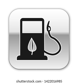 Black Bio fuel concept with fueling nozzle and leaf icon isolated on white background. Gas station with leaves. Eco refueling. Silver square button. Vector Illustration