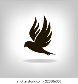 Black bird with expanded wings. Logo design for company.