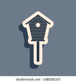 Black Bird house icon isolated on grey background. Nesting box birdhouse, homemade building for birds. Long shadow style. Vector Illustration