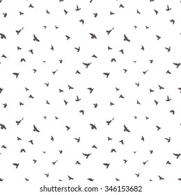 black birds silhouettes on white background; seamless pattern; grunge vector