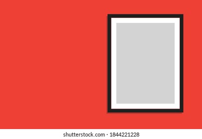 Black Blank Picture Frame with Room for Copy on a Red Wall