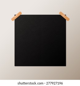 Black blank square piece of paper taped to the wall with a piece of plaster, vector mock-up illustration