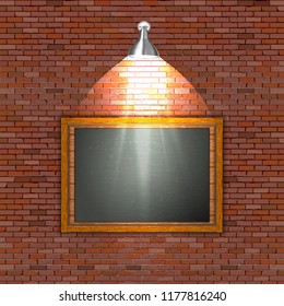 Black board on a brick wall with illumination.