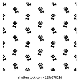 Black bone and paw on white background. Black and white seamless pattern