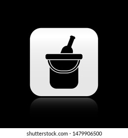 Black Bottle of wine in an ice bucket icon isolated on black background. square button. Vector Illustration