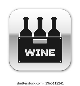 Black Bottles of wine in a wooden box icon isolated on white background. Wine bottles in a wooden crate icon. Silver square button. Vector Illustration