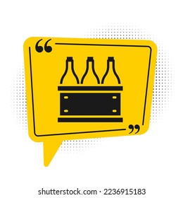 Black Bottles of wine in a wooden box icon isolated on white background. Wine bottles in a wooden crate icon. Yellow speech bubble symbol. Vector