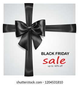 Black bow with crosswise ribbons with shadow and inscription Black Friday Sale on gray background