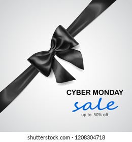 Black bow with diagonally ribbon with shadow and inscription Cyber Monday Sale on white background