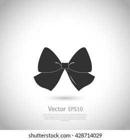 Black bow logo or icon.