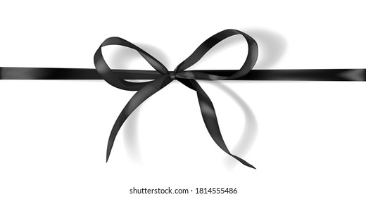 Black bow made of narrow ribbon with shadow on white background. Horizontal arrangement