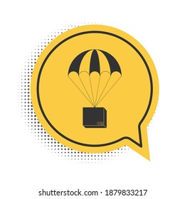 Black Box flying on parachute icon isolated on white background. Parcel with parachute for shipping. Delivery service, air shipping concept, bonus. Yellow speech bubble symbol. Vector.