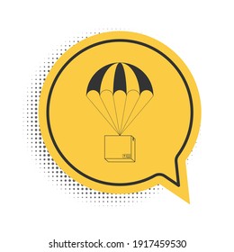 Black Box flying on parachute icon isolated on white background. Parcel with parachute for shipping. Delivery service, air shipping concept, bonus. Yellow speech bubble symbol. Vector.