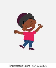 Black boy in jeans pointing to something funny on his left.