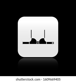 Black Bra icon isolated on black background. Woman underwear. Silver square button. Vector Illustration