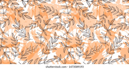 Black branches and leaves on an orange background. Paint splashes, seamless pattern.