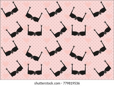 Black bras pattern on a pink polka dot background with hearts